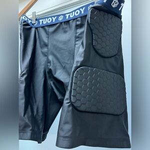 TUOY Men’s padded compression football shorts black size XXL
